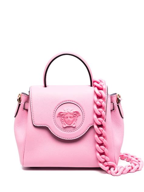 pink versace perfume with backpack.